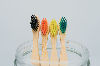 Eco-friendly kids bamboo toothbrushes in a jar close up