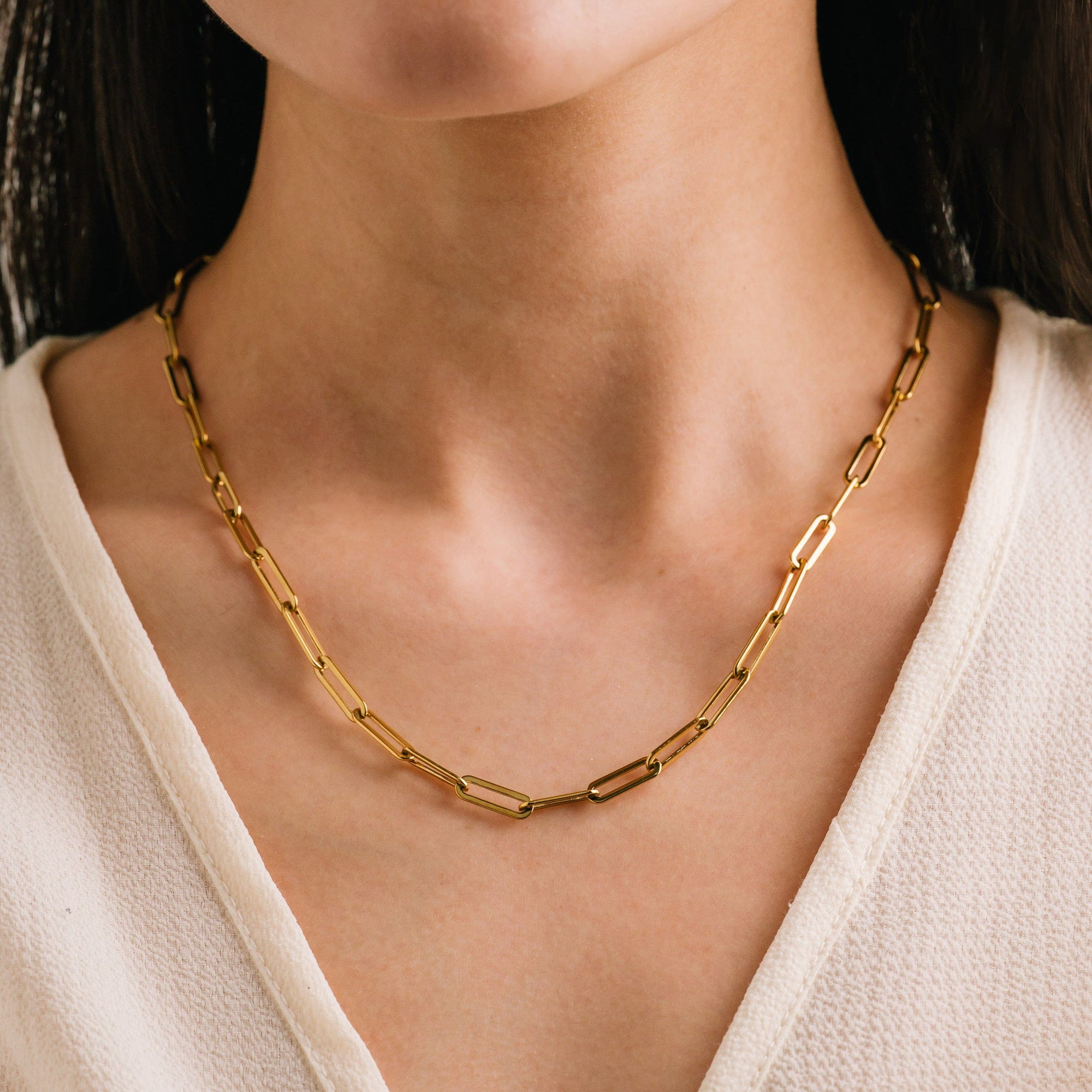Bold paperclip necklace in gold by Lover's Tempo, worn