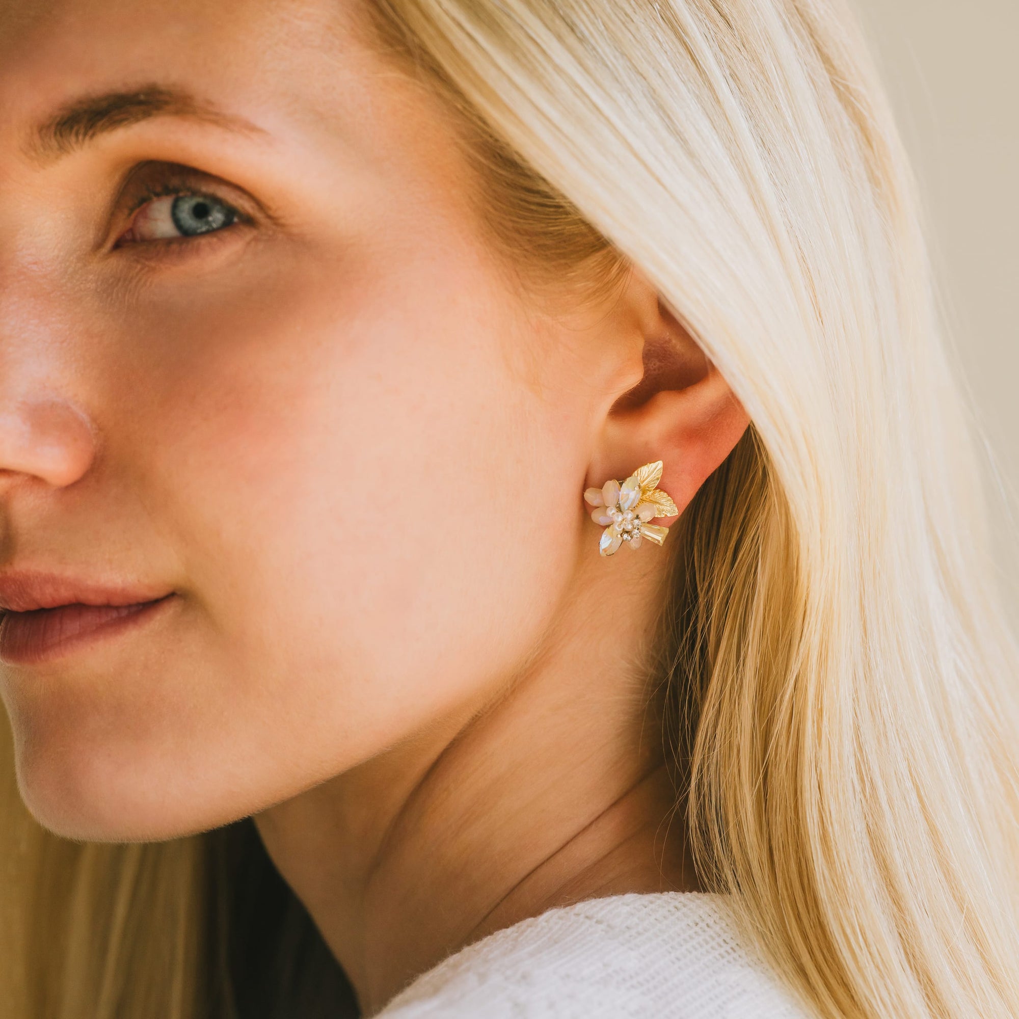 Botanist stud earrings in creme by Lover's Tempo, worn