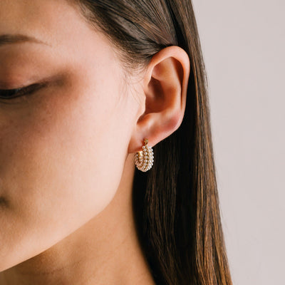 Perla pearl hoop earrings in gold by Lover's Tempo, styled photo