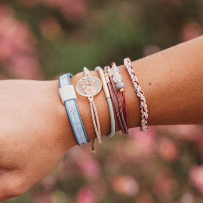 Bloom hair tie bracelet with gold charm and flower details