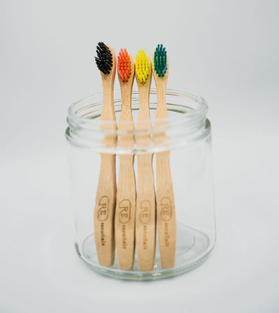 Eco-friendly kids bamboo toothbrushes in a jar